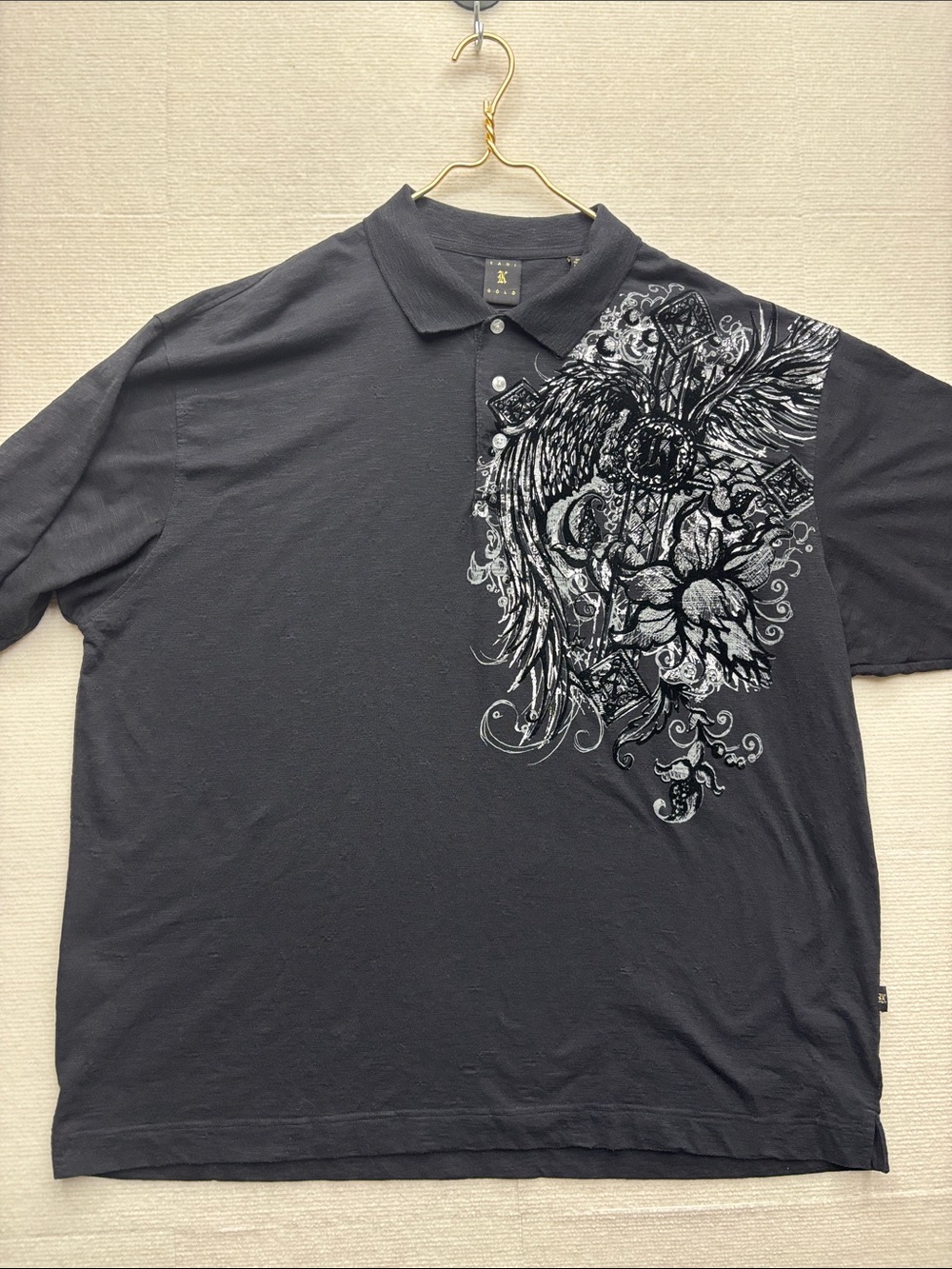 Black Polo Shirt with Ornate Wing & Floral Graphic